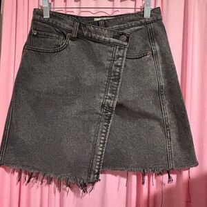 We The Free Black Frayed Asymmetrical Wrap Mini with Button Fly Closure.